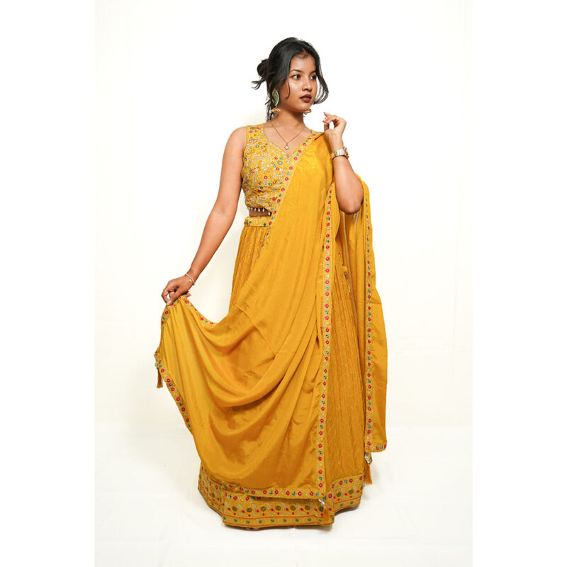 Mustard Yellow Designer Lehenga in Crape Silk with Mirror & Thread Work, Crystal Tassels, and Sequence Detailing
